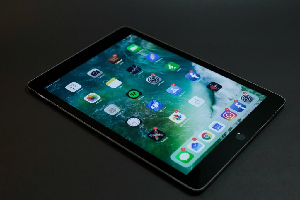A sleek tablet with various multimedia and social media app icons on display.Best Tablets