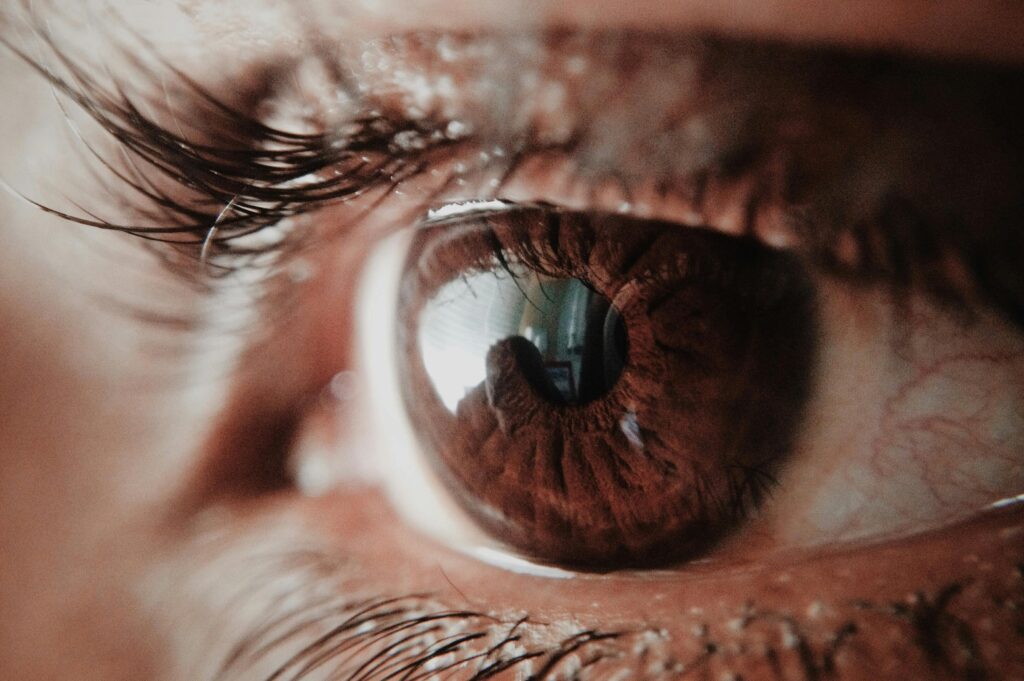 Detailed macro shot of a human eye capturing intricate details of the iris and reflections. VisiSharp